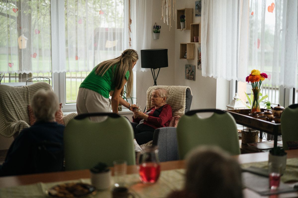 Caregiver spending an evening with a client at home
