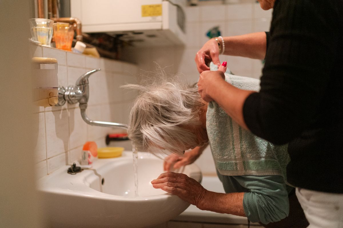 Caregiver assisting a client with personal care